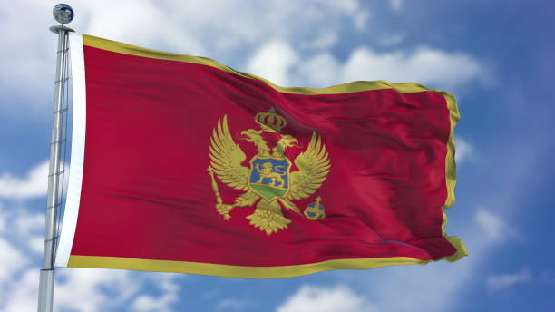 istock Montenegro Flag in a Blue Sky 940324688