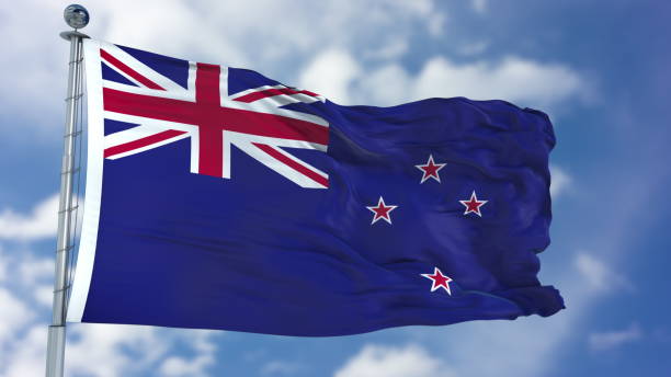 istock New Zealand Flag in a Blue Sky 940324760