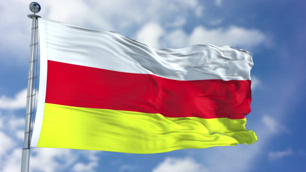 istock South Ossetia Flag in a Blue Sky 940326764