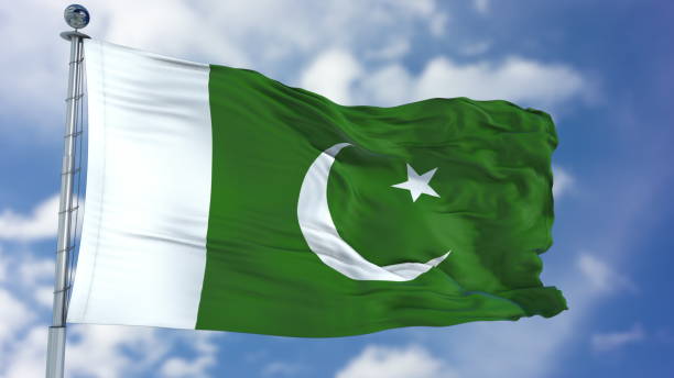 istock Pakistan Flag in a Blue Sky 940326824