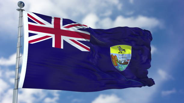 istock Saint Helena Flag in a Blue Sky 940326974