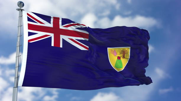 istock Turks and Caicos Islands Flag in a Blue Sky 940329524