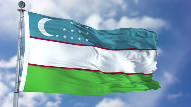 istock Uzbekistan Flag in a Blue Sky 940329656