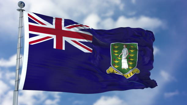 istock Virgin Islands UK Flag in a Blue Sky 940329700