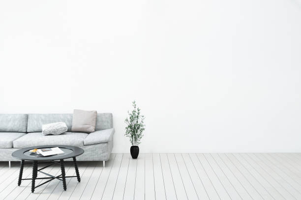 istock Livingroom interior wall mock up with gray fabric sofa and pillows on white background with free space on right. 3d rendering. 940333372