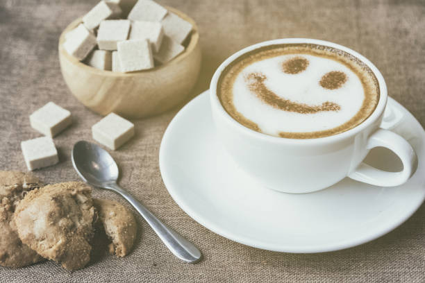 istock A cup of cafe latte with coffee beans and cookies 940334566