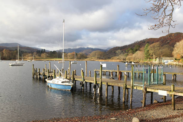 istock small harbour ship in village at England. 940337720