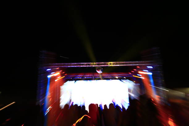 istock Stage lighting effect in the dark, fuzzy figure 940349056