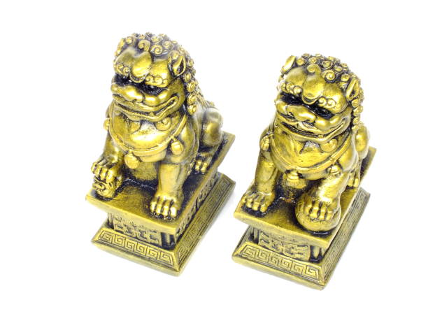 istock chinese imperial lion statue isolated on white background 940352552