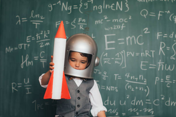 young business boy with space helmet and rocket - algorithm formula mathematical symbol engineering imagens e fotografias de stock