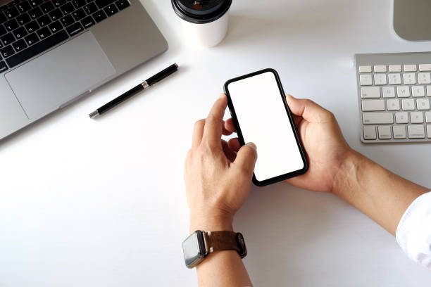 istock Business man holding smartphone 940361388