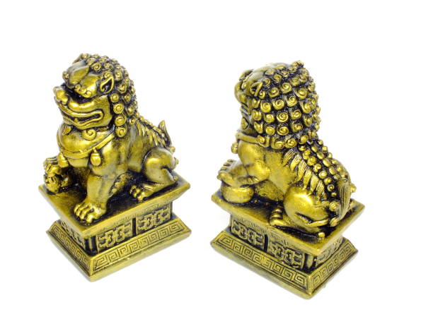 istock chinese imperial lion statue isolated on white background 940361424