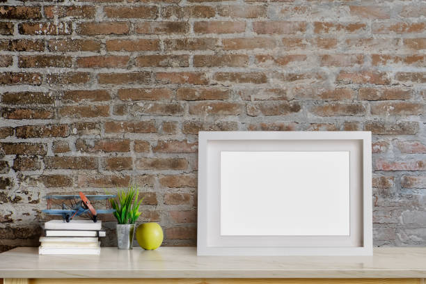 istock Mock up contemporary blank frame photo on table 940361442