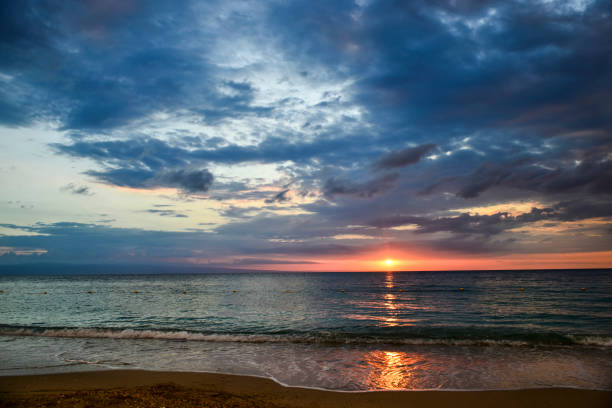istock Romantic moody sunset on the beach, Montrouis, Haiti 940366480