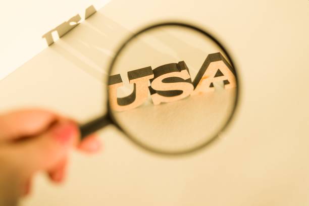 istock Magnifying glass on white background with the word USA 940366574