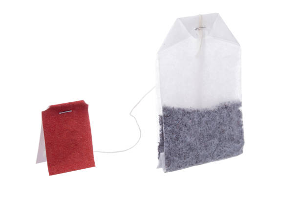 istock Classic teabag with red label isolated on white background 940369058