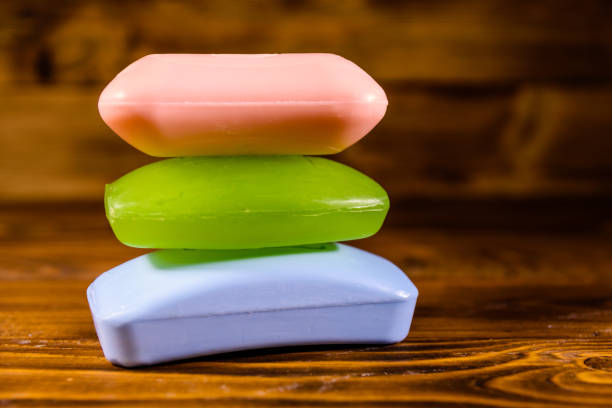 istock Pieces of the soap on wooden table 940370022