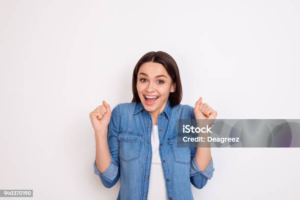 Portrait Of Excited Young Girl In Jeans Shirt Opened Mouth Expressing Happiness Stock Photo - Download Image Now