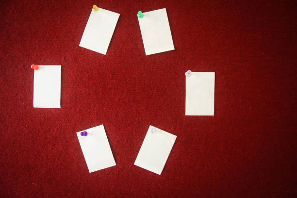 istock collection of note papers pinned on a red board ready for filling in quotes. 940373496