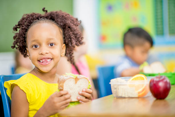 istock Girl Eating A Sanndwich 940373800