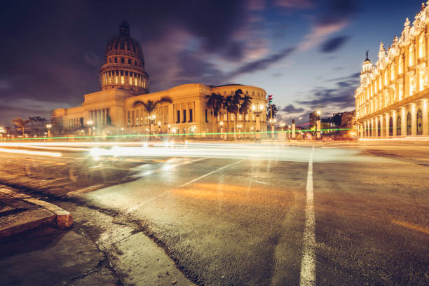 istock illuminated Capitol building with blurred motion traffic at night,Havana,Cuba 940375228
