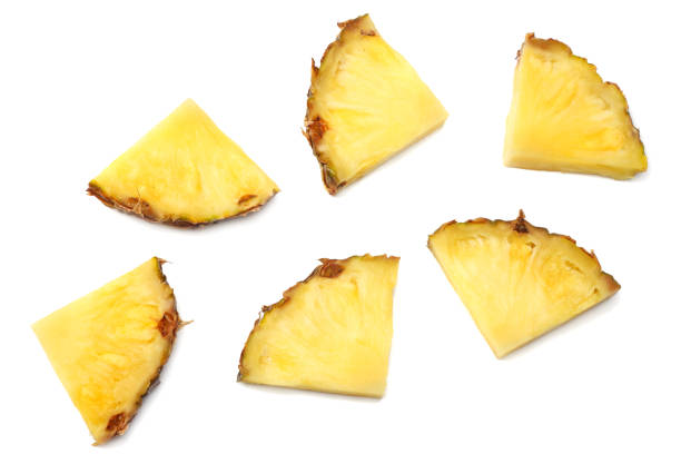 istock healthy background. pineapple slices isolated on white background top view 940381812