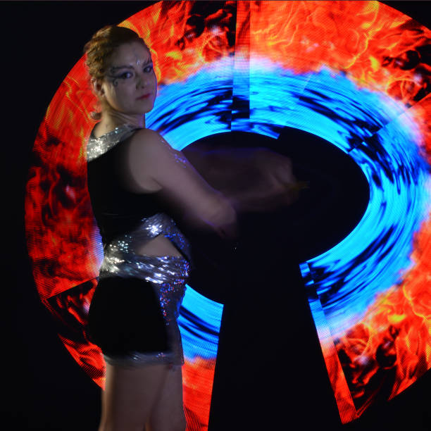 istock Led poi. Laser show performance, dancer in led suits with LED lamp 940382012