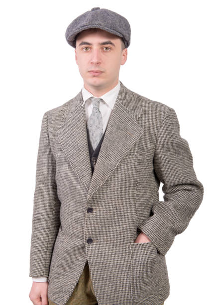 istock a young man in vintage clothes with hat, 1930 style 940385900