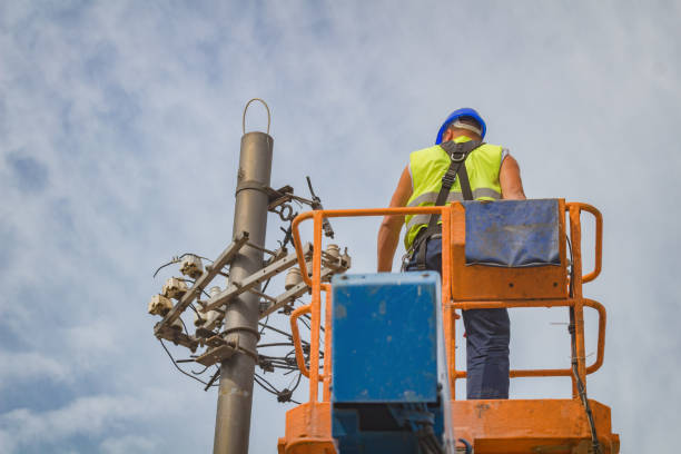 istock Power line worker fixing from the truck basket. 940390808