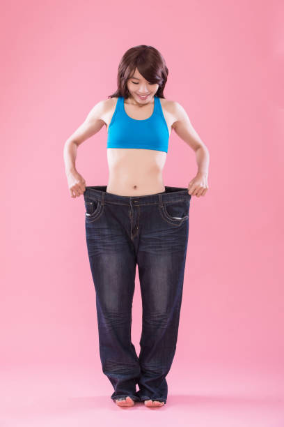 istock woman show weight loss 940391378