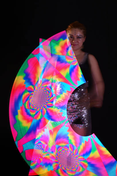 istock Led poi. Laser show performance, dancer in led suits with LED lamp 940400776