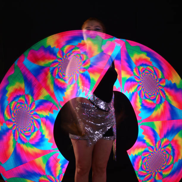 istock Led poi. Laser show performance, dancer in led suits with LED lamp 940403406