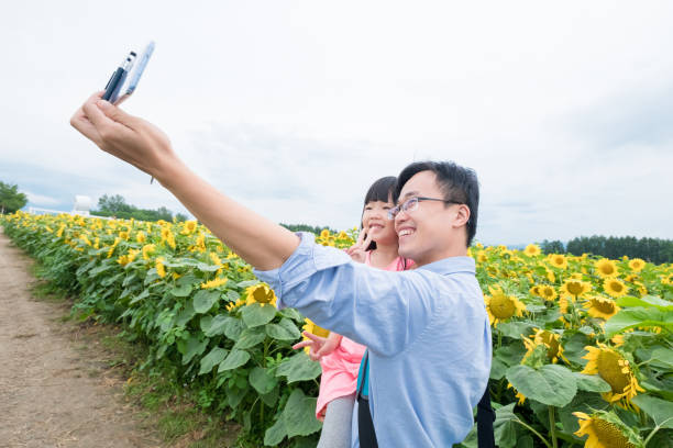 istock father and daughter selfie happily 940403540