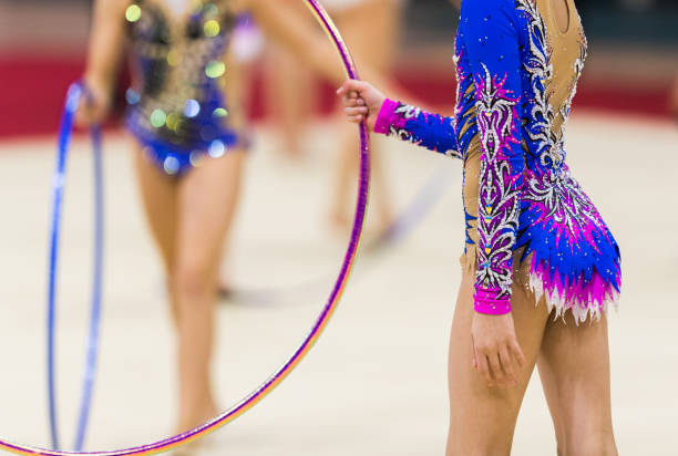 girl in beautiful gymnastic dress doing exercise - small gymnastics athlete action imagens e fotografias de stock