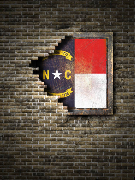 istock Old North Carolina flag in brick wall 940407722