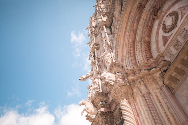 Gargoyles and Saints on facade of Siena Cathedral