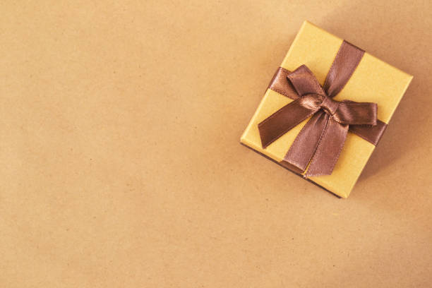 istock golden gift box on wrapping paper 940408430