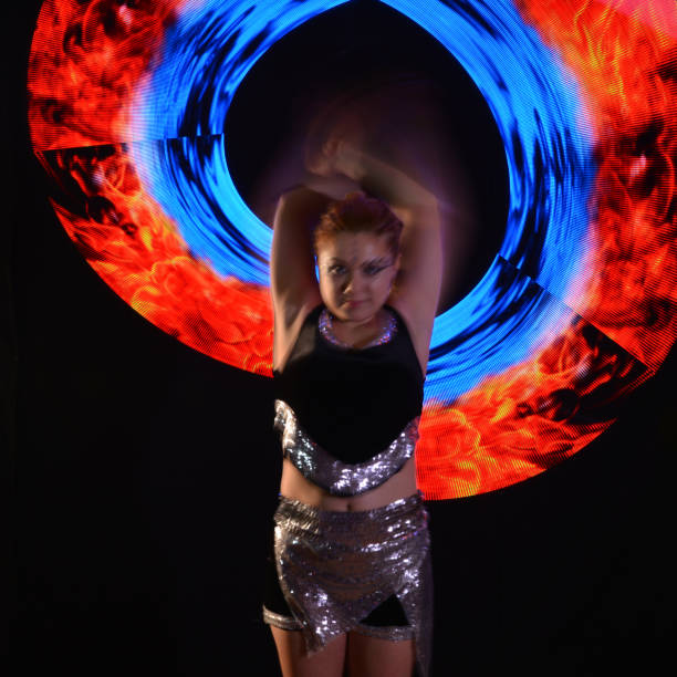 istock Led poi. Laser show performance, dancer in led suits with LED lamp 940414426