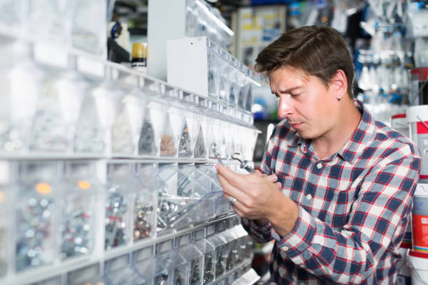 istock Cheerful male customer in store searching goods 940415026