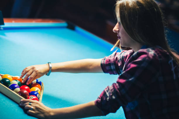 istock Woman preparing table for billiard game. 940423212