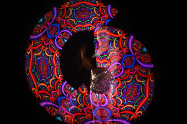 istock Led poi. Laser show performance, dancer in led suits with LED lamp 940425354