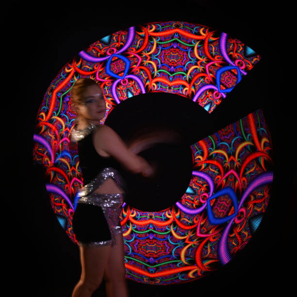 istock Led poi. Laser show performance, dancer in led suits with LED lamp 940427204