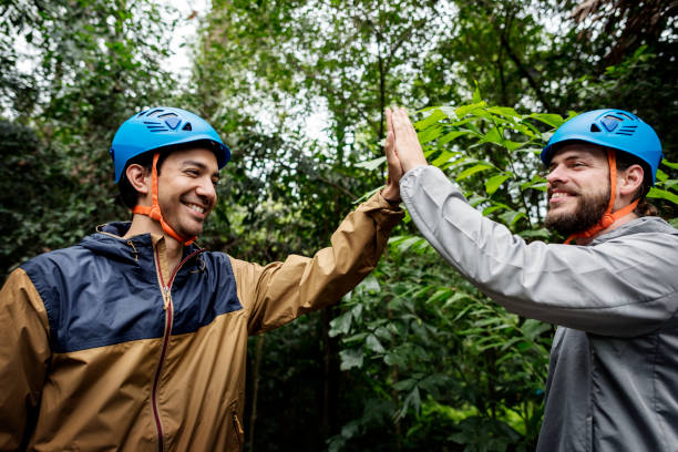 istock Team building outdoor in the forest 940429064