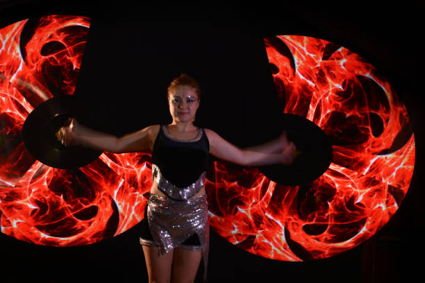 istock Led poi. Laser show performance, dancer in led suits with LED lamp 940432174