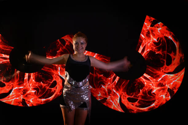 istock Led poi. Laser show performance, dancer in led suits with LED lamp 940432762