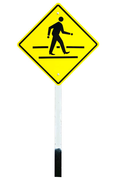 istock yellow traffic sign crossing road 940437396