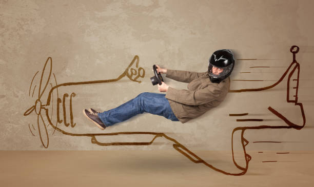 istock Funny pilot driving a hand drawn airplane on the wall 940441582
