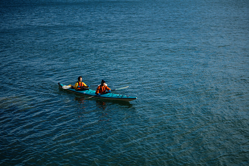 Two women sea kayaking together