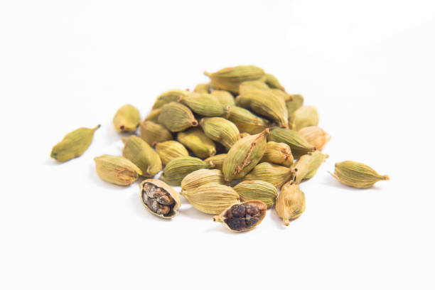 istock Organic cardamom pods on white background 940445548