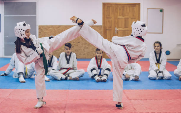 istock Cute kids training taekwondo 940445658